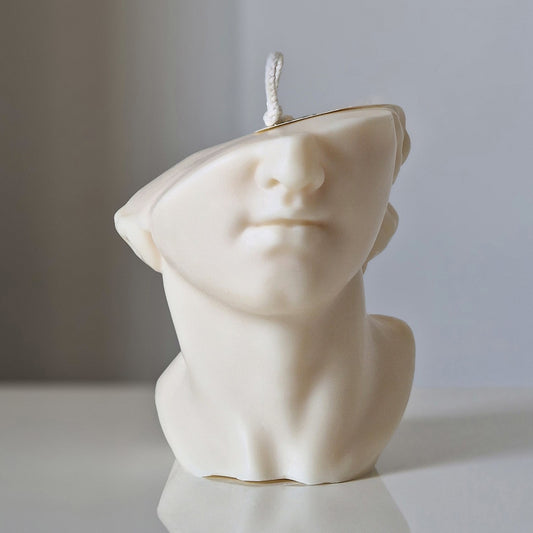Half cut face sculptural scented candle made with natural rapeseed wax and authentic fragrance from South of France